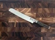 Shun Premier Grey Bread Knife 9 inch Hammered Damascus Tsuchime Finish Grey Hand